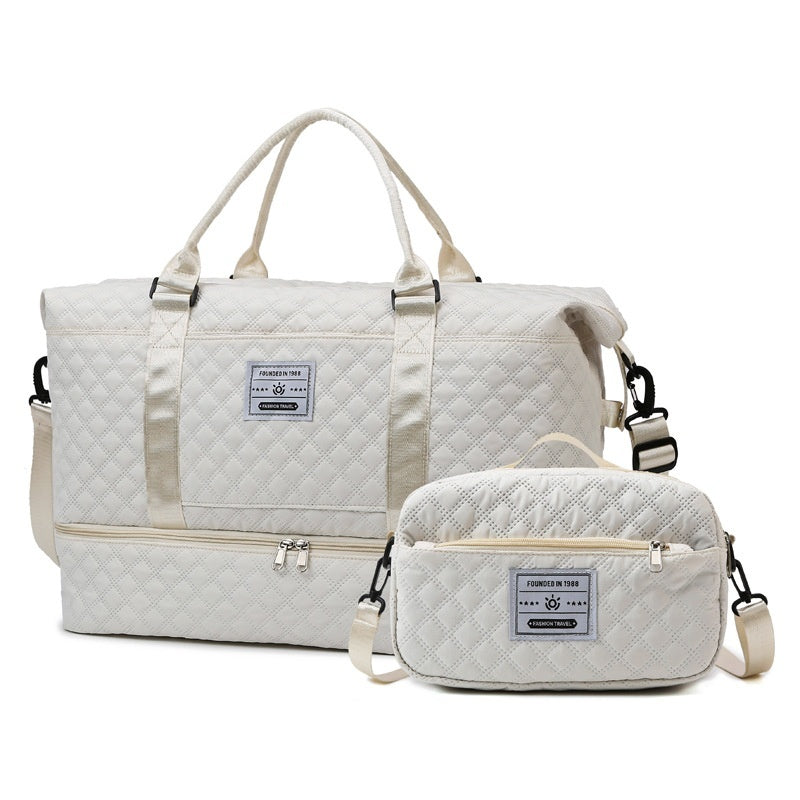 White quilted travel bag with zip compartment and matching crossbody pouch