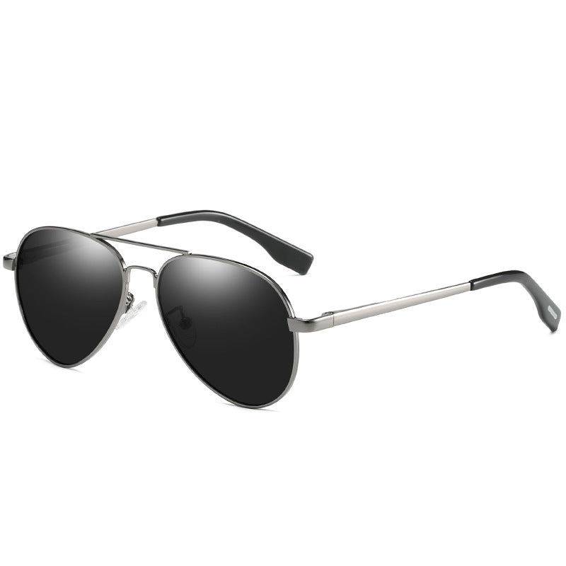 Sunglasses with black lenses and silver frame on a white background
