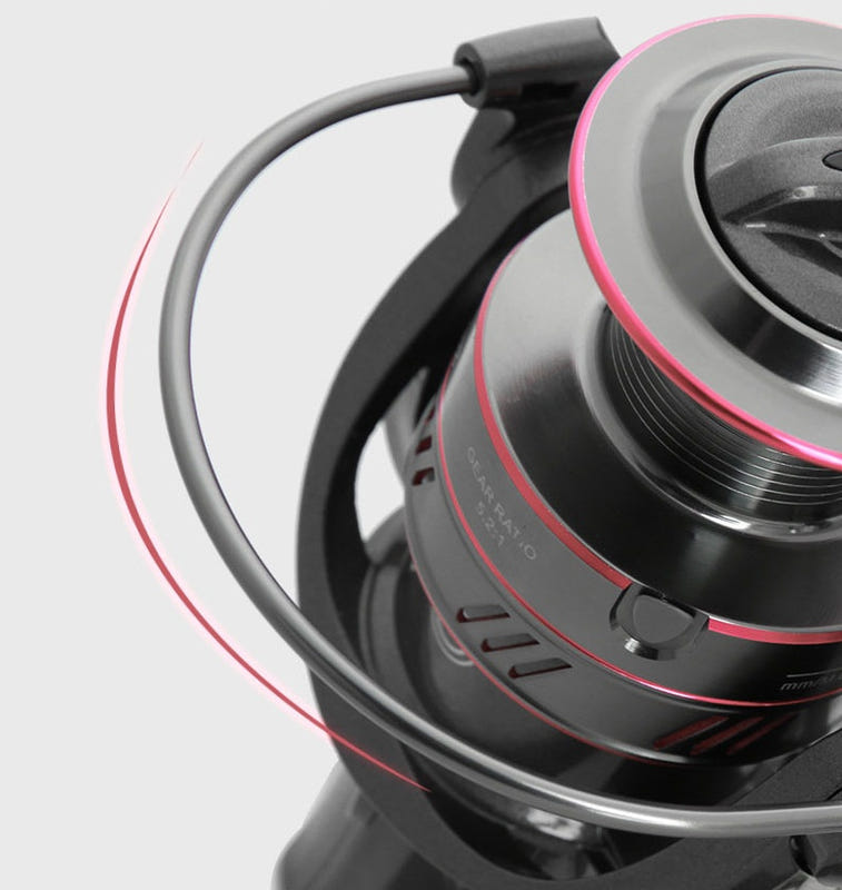 Full metal fishing reel close-up of gray spool with black bail and handle arm