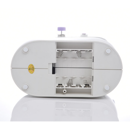White sewing machine on a white background