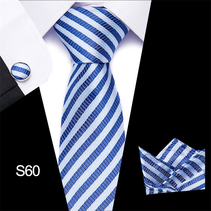 Blue and white striped tie set with matching pocket square and cufflinks on a black background.