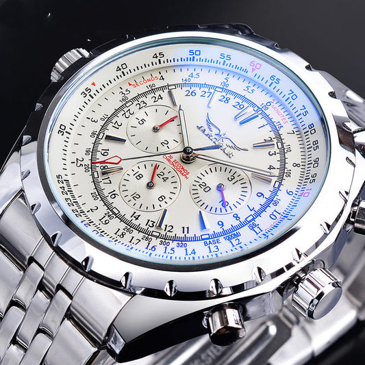 White dial chronograph watch with blue tachymeter markings, silver link bracelet