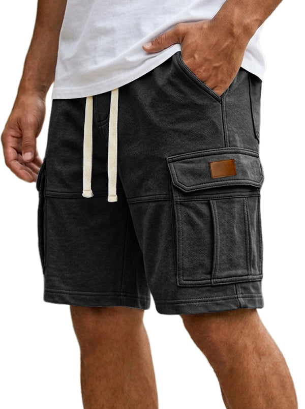 Black cargo shorts with a Nike logo on a white background