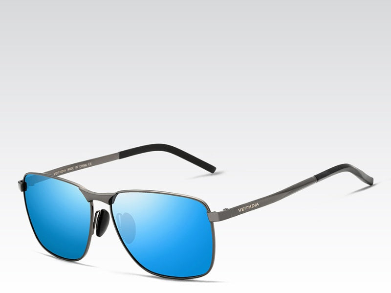 Sunglasses with blue lenses and black frame on a light gray background