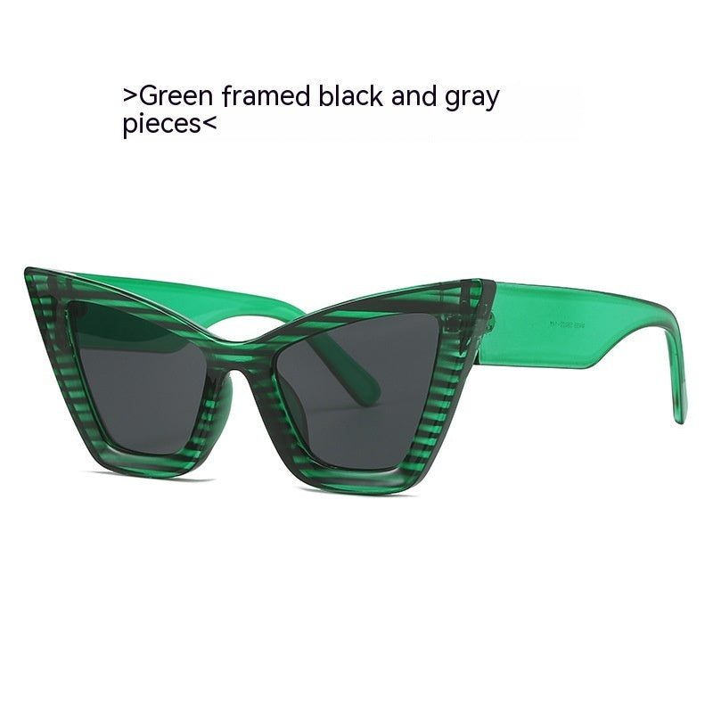 Green framed sunglasses with black lenses on a white background