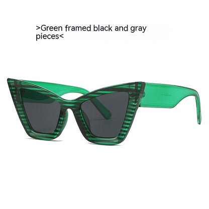 Green framed sunglasses with black lenses on a white background