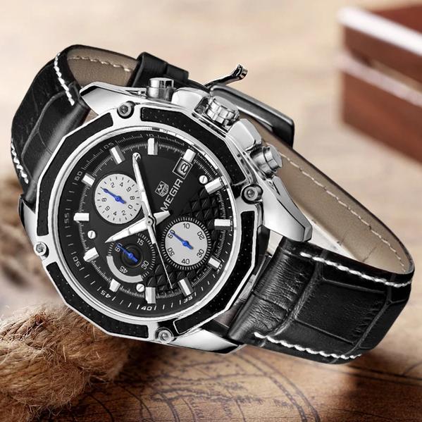 Angled view of a black-dial MEGIR quartz watch with black stitched strap on a map