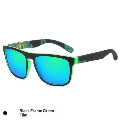 Sunglasses with black frame and green-tinted lenses on a white background