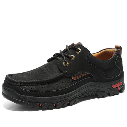 Black leather shoe with brown accents on a white background
