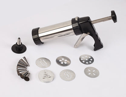 Syringe-like kitchen tool with various metal nozzles on a white background