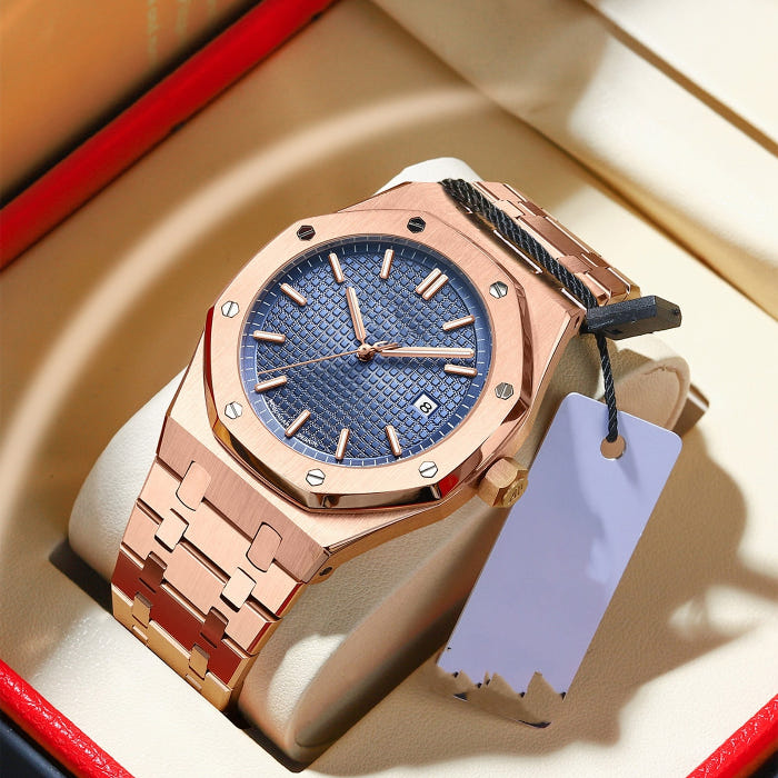Rose gold quartz wristwatch with blue dial and metal link bracelet, signed crown.
