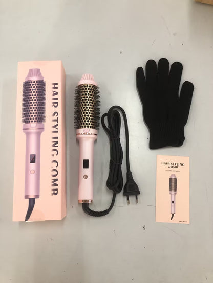 Hair styling comb with packaging, glove, and power cord on a white surface