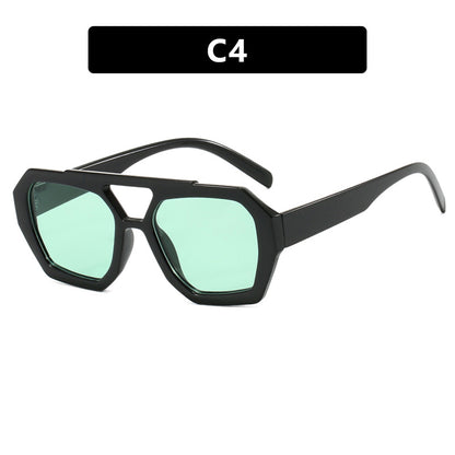 Sunglasses with black frame and green lenses on a white background