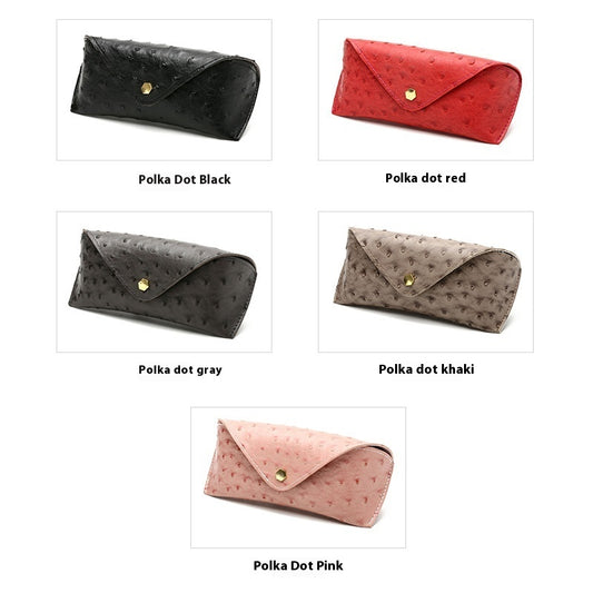 Set of polka dot clutch bags in various colors on a white background