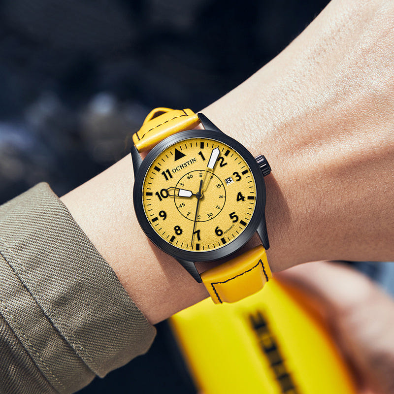 Men's yellow leather automatic wristwatch with round gold dial and black bezel