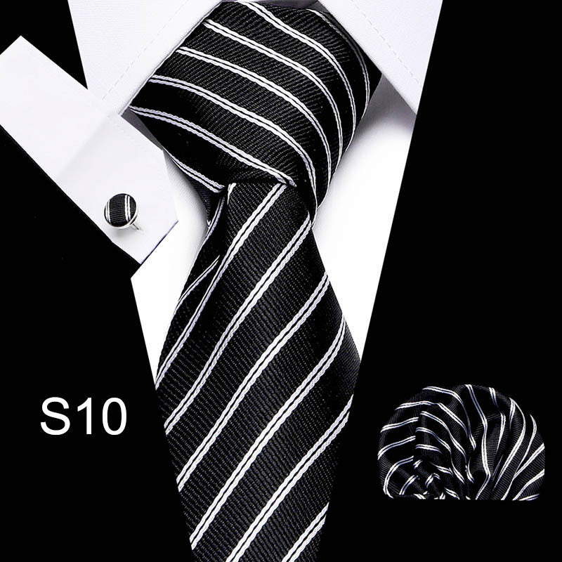 Black and white striped tie with matching pocket square on a white background