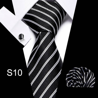 Black and white striped tie with matching pocket square on a white background