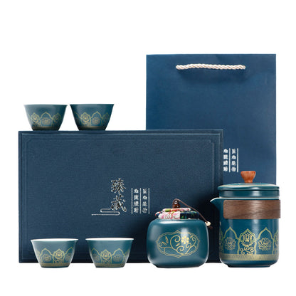 Tea set with blue containers and matching cups on a white background