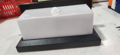 Rectangular outdoor wall lamp base with black mounting plate and white top cover