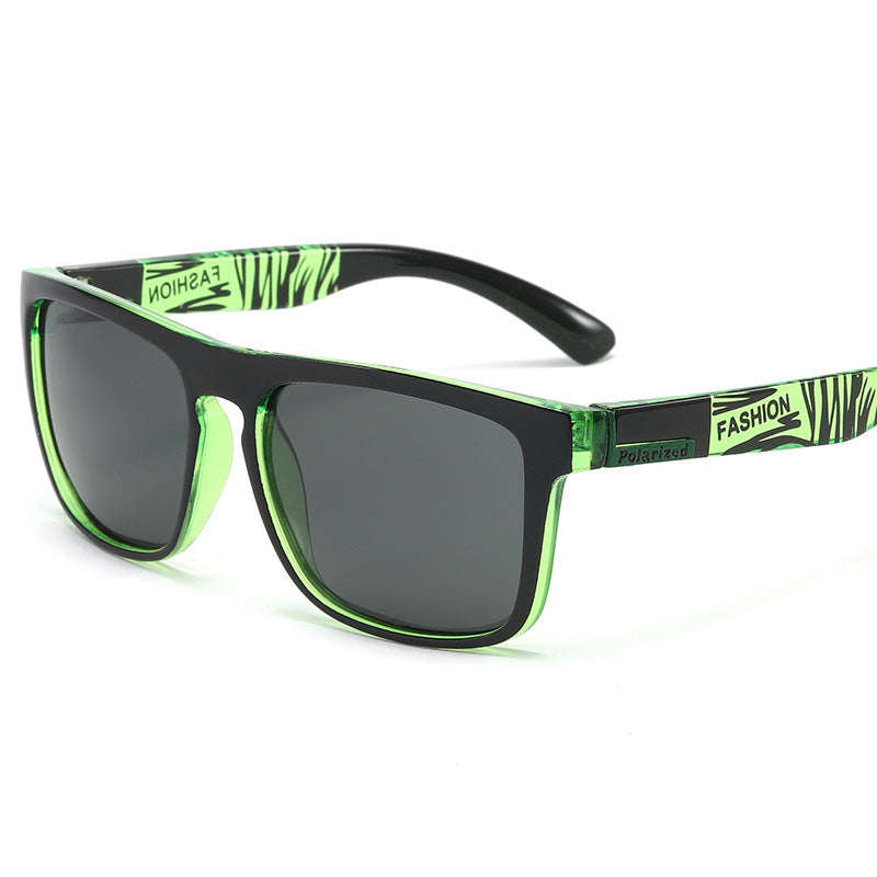 Sunglasses with green and black frame on a white background