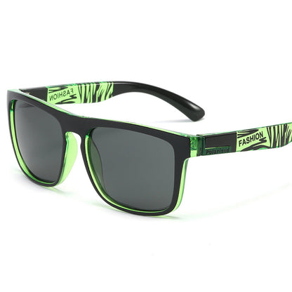 Sunglasses with green and black frame on a white background