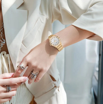 Women’s gold-tone link bracelet quartz watch with round white dial and diamond markers