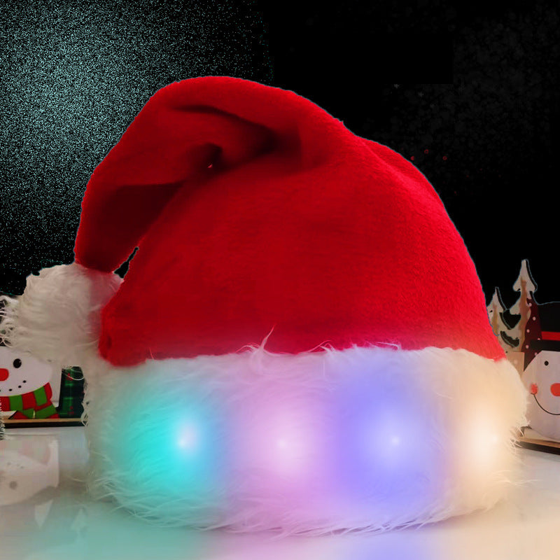 Red Santa hat with LED lights on a dark background