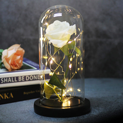 LED rose glass dome lamp with white rose under clear dome, black base