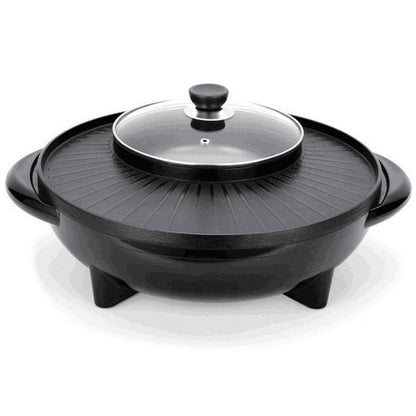 Black electric skillet with glass lid on a white background