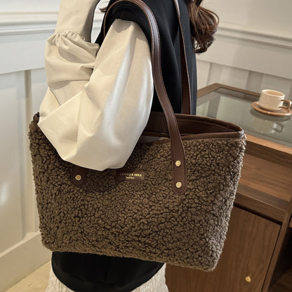 Dark brown fuzzy tote shoulder bag with top handles and snap button details
