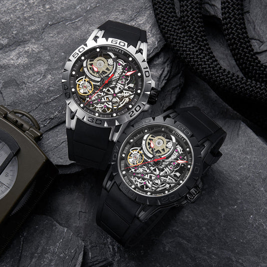 Two black wristwatches with detailed faces on a textured surface
