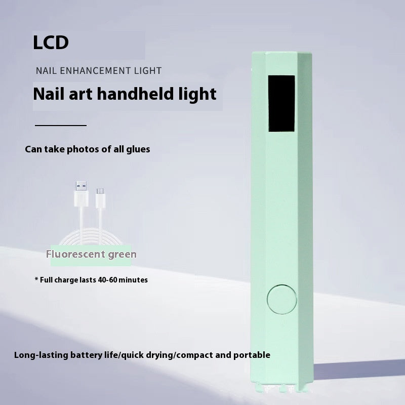Nail art handheld light with green fluorescence on a gray background
