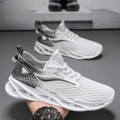 White and black athletic shoes on a gray surface with a blurred background
