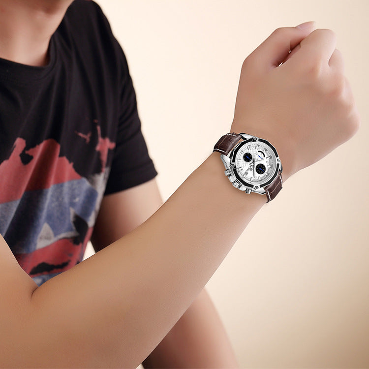 MEGIR quartz watch with white dial and brown stitched strap shown on a raised wrist
