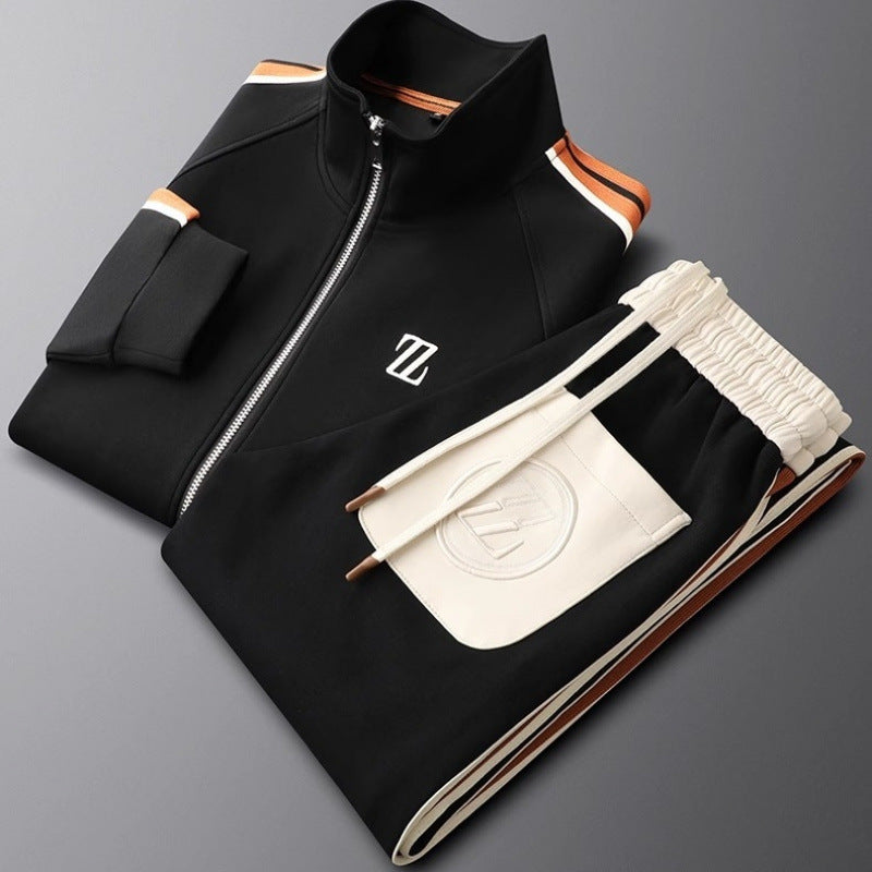 Black and beige tracksuit with a brand logo on a gray background
