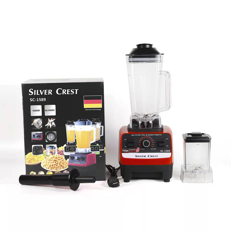 Red countertop blender set with clear jug, small jar, and Silver Crest product box