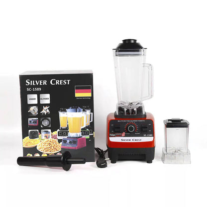Red countertop blender set with clear jug, small jar, and Silver Crest product box