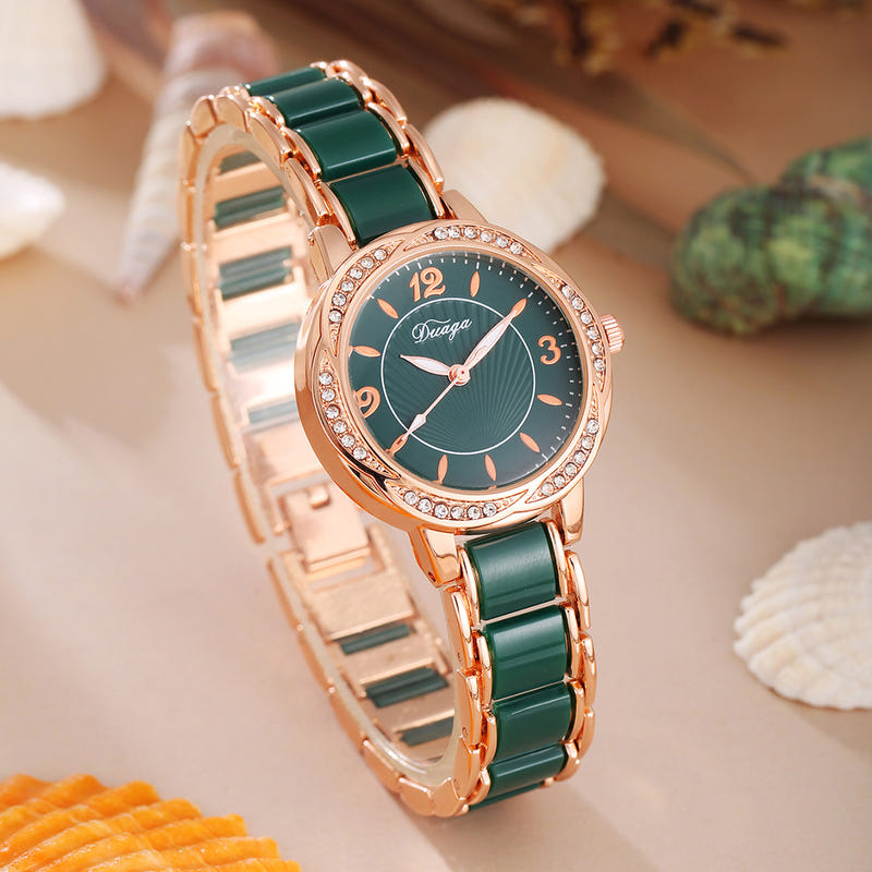 Rose gold round quartz wristwatch with green dial and green link bracelet