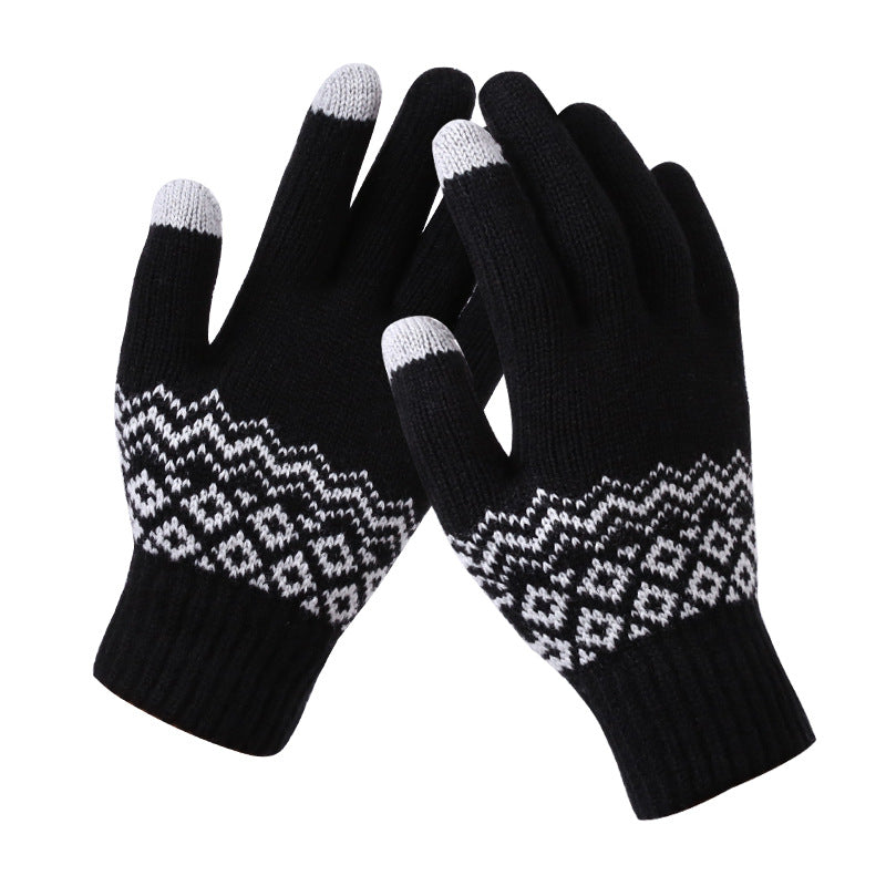Pair of black gloves with white patterned cuffs on a white background