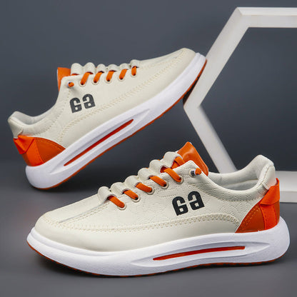 Men's light lace-up sneakers with orange accents, thick sole, two-shoe view