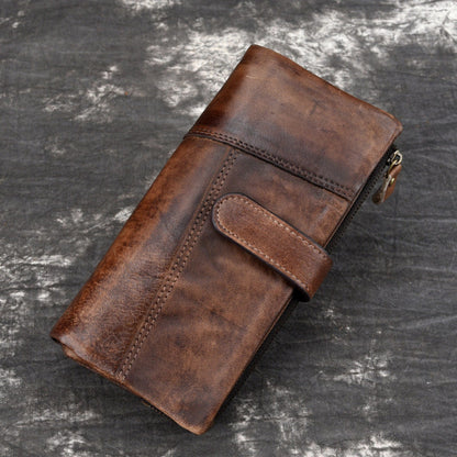 Brown vintage leather long wallet with zipper, front pocket, and stitched details