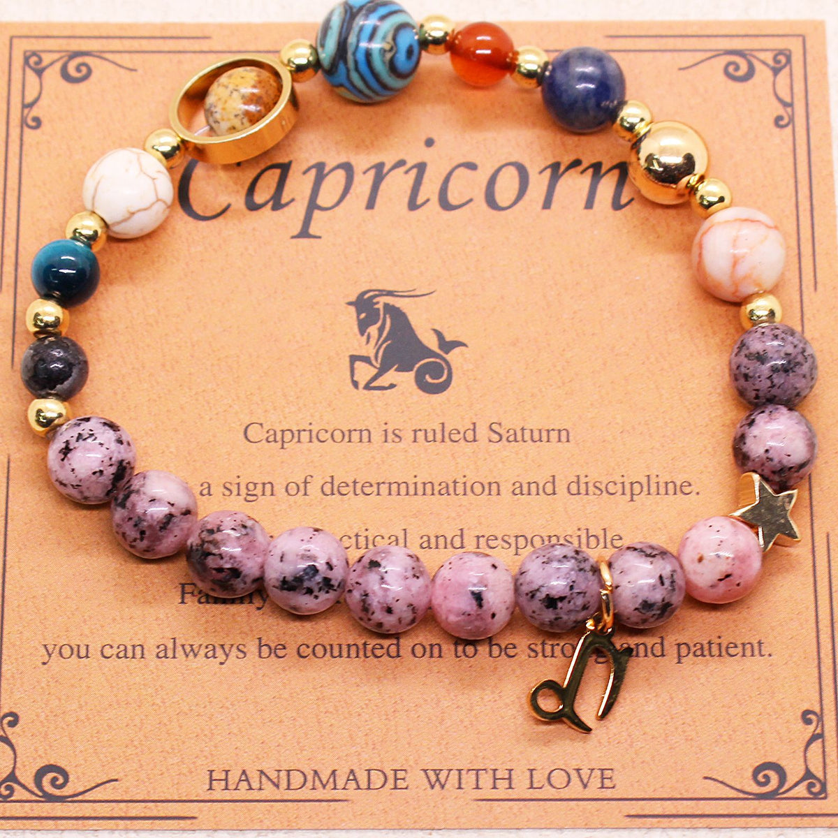 Zodiac bracelet with purple speckled and blue beads, gold-tone accents, and Capricorn charm