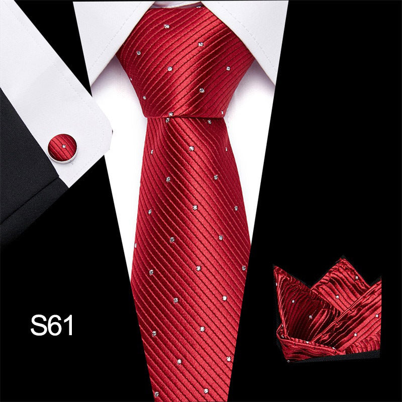 Red tie with silver dots on a white shirt, with a close-up of the tie's pattern on a black background.