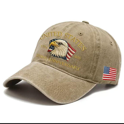 Khaki washed-print cap with gold “United States 1776–2026” eagle graphic and flag patch.
