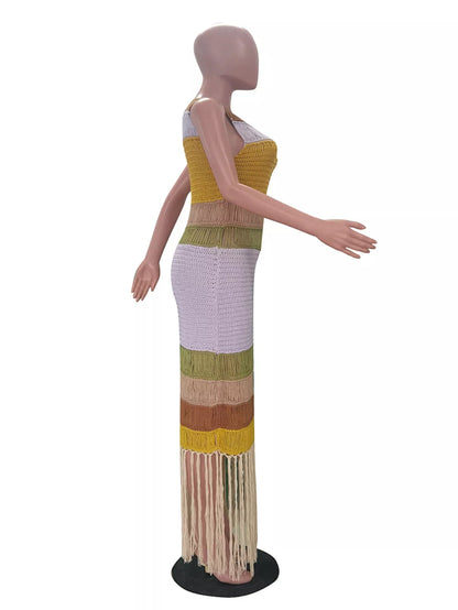 Mannequin wearing a colorful, patterned dress on a white background