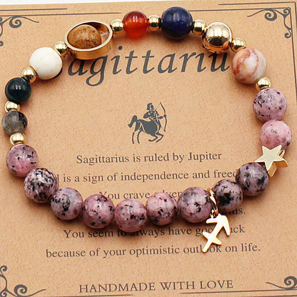 Natural stone bead bracelet on hemp cord with gold-tone star charm