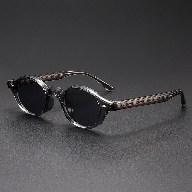 Pair of sunglasses with wooden accents on a dark gray background