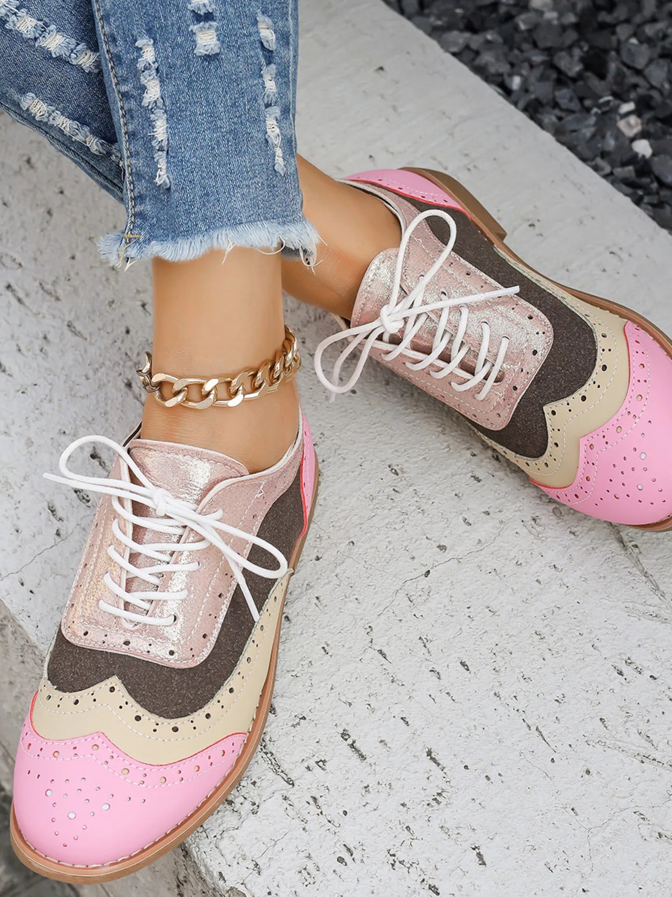 Pink, tan, and dark brown color-block lace-up flats with round toe and white laces
