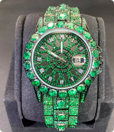 Luxury green gemstone watch on a gray stand