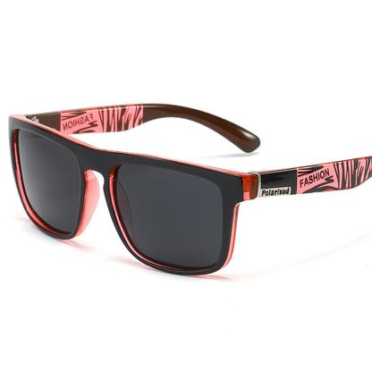 Sunglasses with pink and black frame on a white background